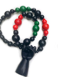 Hand carved wooden fist necklace red black green pan African black power fist redemption